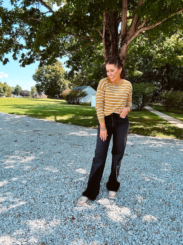Lightweight, thin, soft striped crewneck long sleeved sweater.