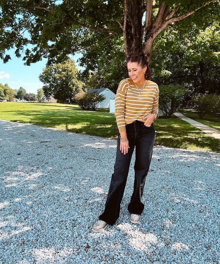 Lightweight, thin, soft striped crewneck long sleeved sweater.