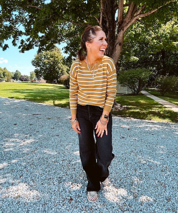 Lightweight, thin, soft striped crewneck long sleeved sweater.