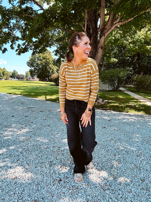 Lightweight, thin, soft striped crewneck long sleeved sweater.