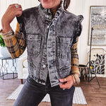 Washed black denim vest with ruffles at collar and sleeves, front pockets and silver buttons down the front.