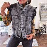 Washed black denim vest with ruffles at collar and sleeves, front pockets and silver buttons down the front.