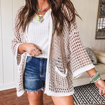 Open weave open front cardigan in taupe with cream trim and pockets.