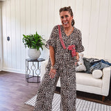 Wide leg lightweight leopard print pants with elastic waist, pockets and ruffled cuffs.