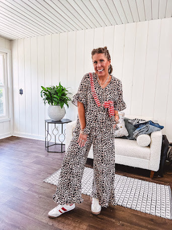 Wide leg lightweight leopard print pants with elastic waist, pockets and ruffled cuffs.