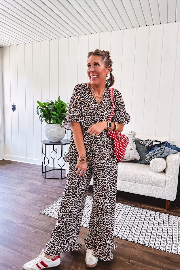 Wide leg lightweight leopard print pants with elastic waist, pockets and ruffled cuffs.