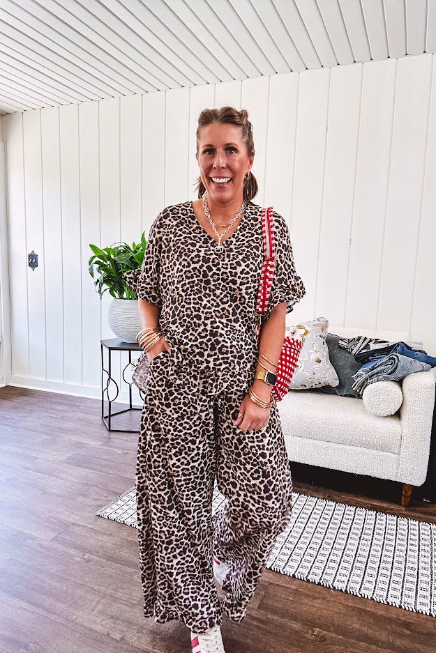 Wide leg lightweight leopard print pants with elastic waist, pockets and ruffled cuffs.