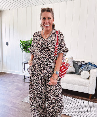 Wide leg lightweight leopard print pants with elastic waist, pockets and ruffled cuffs.