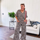 Wide leg lightweight leopard print pants with elastic waist, pockets and ruffled cuffs.