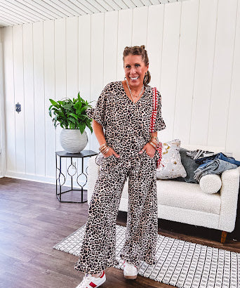 Wide leg lightweight leopard print pants with elastic waist, pockets and ruffled cuffs.