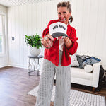 Wide leg black and white striped pants with stretch and pockets, button and zipper closure.