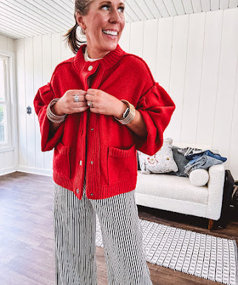 Snap front, balloon sleeve bright red cardigan.