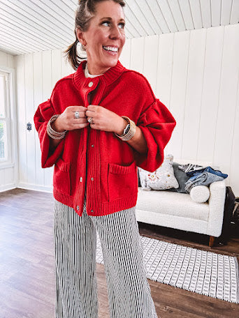 Snap front, balloon sleeve bright red cardigan.