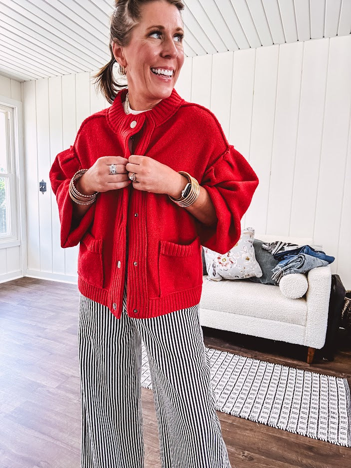 Snap front, balloon sleeve bright red cardigan.