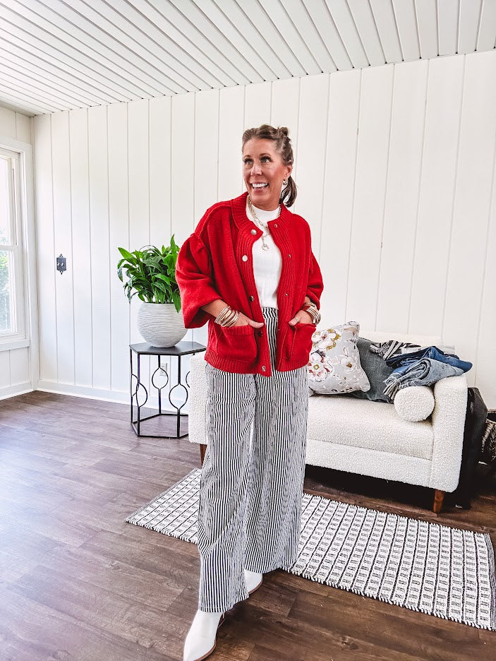 Snap front, balloon sleeve bright red cardigan.