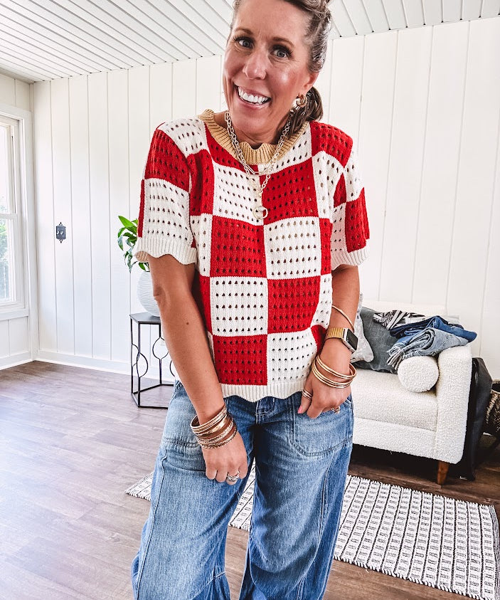 Red and white checkered crocheted short sleeved sweater with tan scalloped neckline and scalloped cuffs and hem.