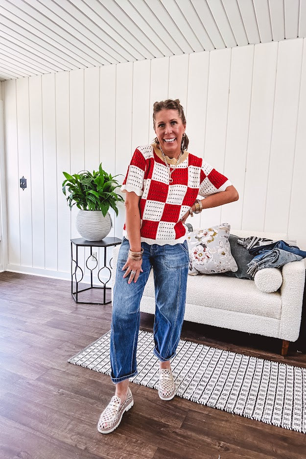Red and white checkered crocheted short sleeved sweater with tan scalloped neckline and scalloped cuffs and hem.