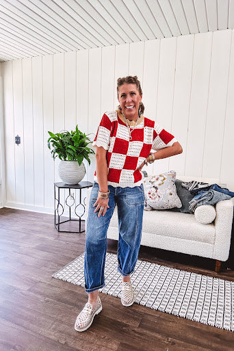 Red and white checkered crocheted short sleeved sweater with tan scalloped neckline and scalloped cuffs and hem.
