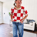 Red and white checkered crocheted short sleeved sweater with tan scalloped neckline and scalloped cuffs and hem.