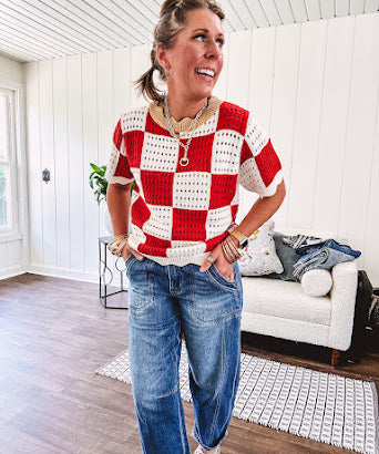 Red and white checkered crocheted short sleeved sweater with tan scalloped neckline and scalloped cuffs and hem.