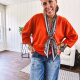 Soft, 3/4 sleeve V neck blouse.