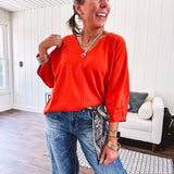 Soft, 3/4 sleeve V neck blouse.