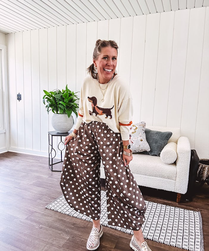 Slick brown with white polka dots balloon style pants with extra volume in the legs and elastic waist.