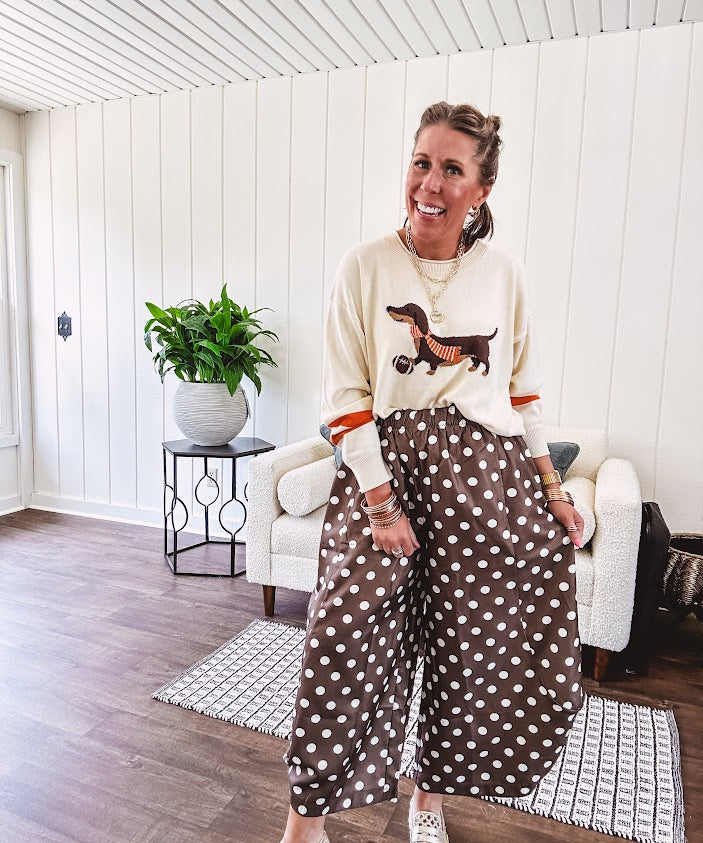 Slick brown with white polka dots balloon style pants with extra volume in the legs and elastic waist.