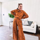 Lightweight rust button front long sleeved shirt with collar and white geometric stitching print throughout.