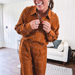 Lightweight rust button front long sleeved shirt with collar and white geometric stitching print throughout.