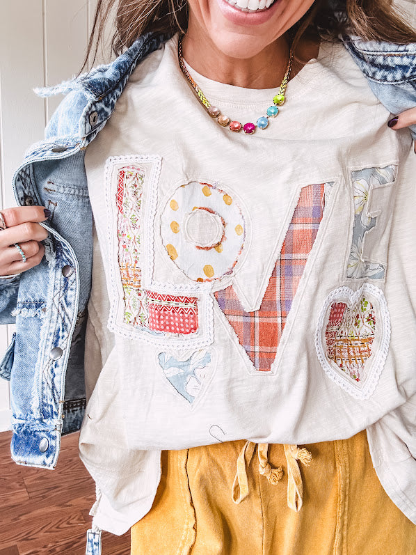 Oversized ivory tee with "LOVE" patchwork and heart patchwork detail on the front with lace trim in pastel florals and plaids.