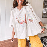Oversized ivory tee with "LOVE" patchwork and heart patchwork detail on the front with lace trim in pastel florals and plaids.