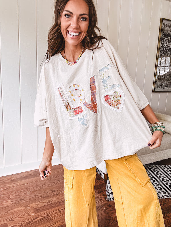 Oversized ivory tee with "LOVE" patchwork and heart patchwork detail on the front with lace trim in pastel florals and plaids.
