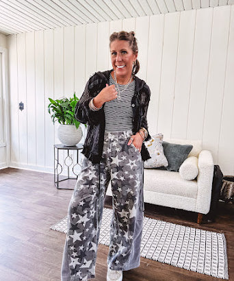 Lightweight grey, cream and black washed star graphic wide leg pants with waffle texture insert on the sides of the legs.