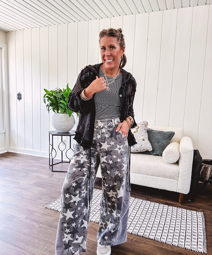 Lightweight grey, cream and black washed star graphic wide leg pants with waffle texture insert on the sides of the legs.