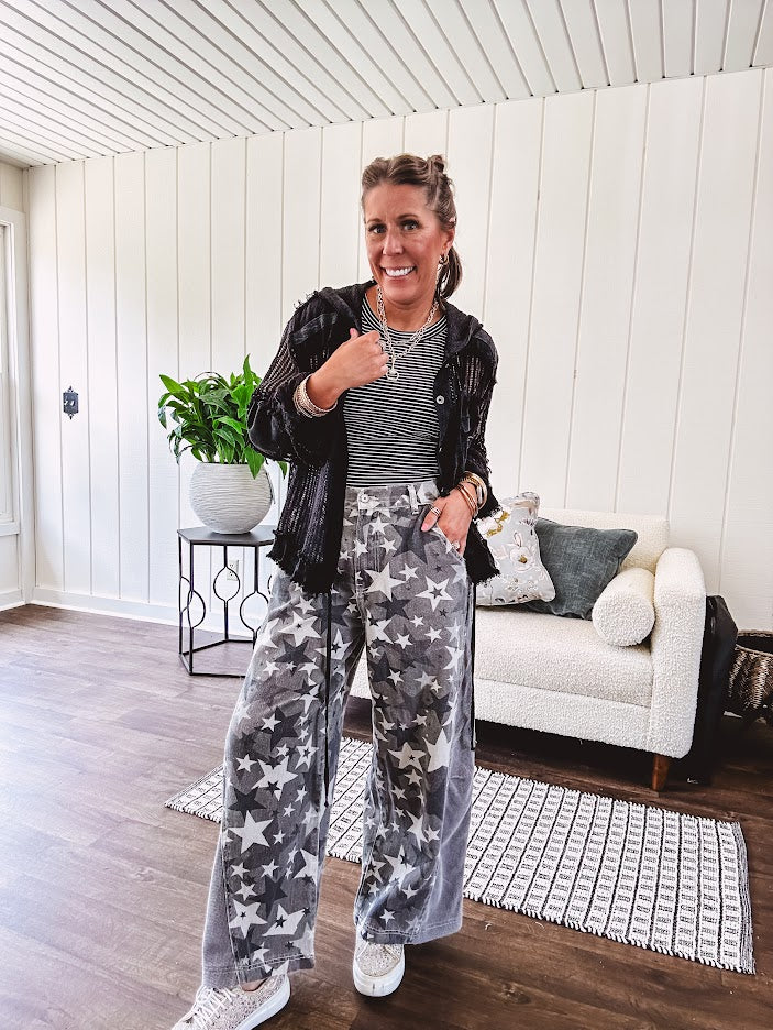 Lightweight grey, cream and black washed star graphic wide leg pants with waffle texture insert on the sides of the legs.