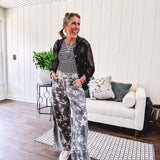 Lightweight grey, cream and black washed star graphic wide leg pants with waffle texture insert on the sides of the legs.