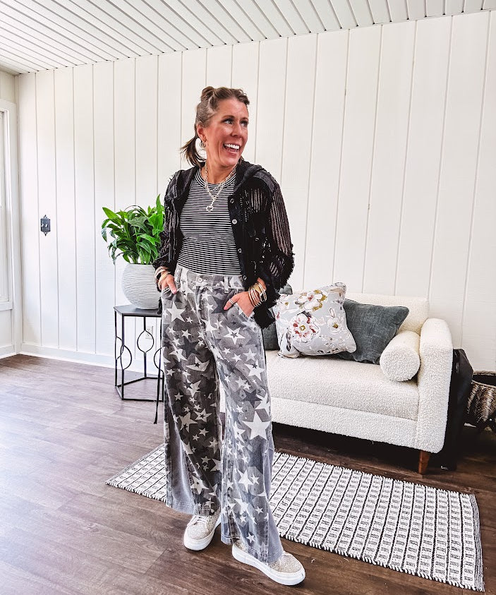 Lightweight grey, cream and black washed star graphic wide leg pants with waffle texture insert on the sides of the legs.