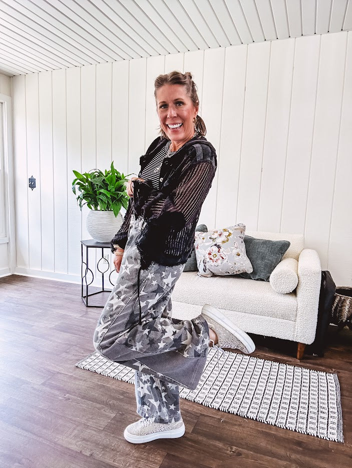 Lightweight grey, cream and black washed star graphic wide leg pants with waffle texture insert on the sides of the legs.