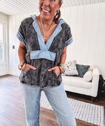 Washed black short sleeved top with matching hood trimmed in light washed chambray denim with kangaroo pocket.