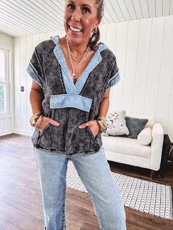 Washed black short sleeved top with matching hood trimmed in light washed chambray denim with kangaroo pocket.