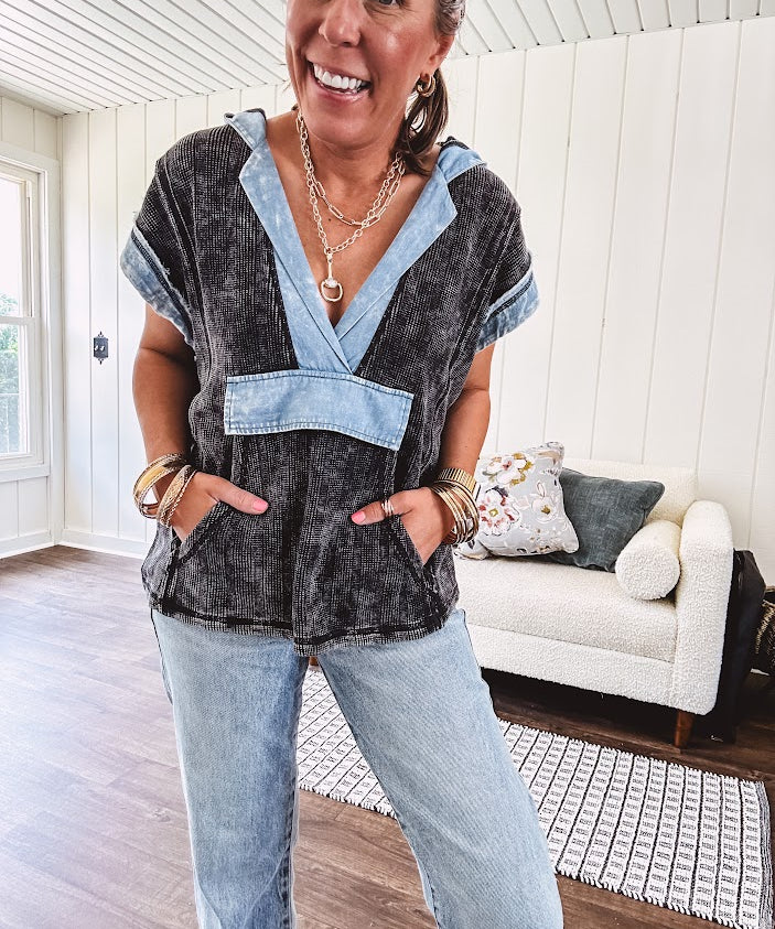 Washed black short sleeved top with matching hood trimmed in light washed chambray denim with kangaroo pocket.