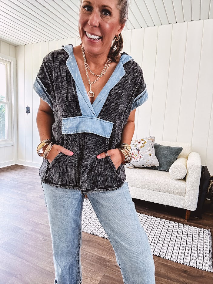 Washed black short sleeved top with matching hood trimmed in light washed chambray denim with kangaroo pocket.