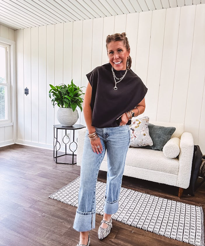 Chic black mock neck zip up back cap sleeve blouse with elastic, balloon waist.