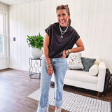 Chic black mock neck zip up back cap sleeve blouse with elastic, balloon waist.