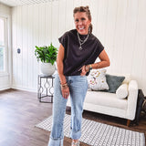 Chic black mock neck zip up back cap sleeve blouse with elastic, balloon waist.