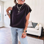 Chic black mock neck zip up back cap sleeve blouse with elastic, balloon waist.
