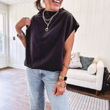 Chic black mock neck zip up back cap sleeve blouse with elastic, balloon waist.