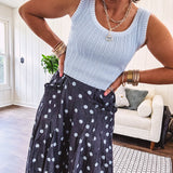 Rib texture wide strap short tank with contrast stitching at round neck and sleeves.