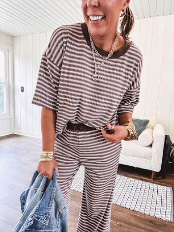 Lightweight ribbed texture brown and white striped short sleeve top and matching wide leg bottoms with elastic waist and contrasting dark brown waffle texture neckline and waistband.